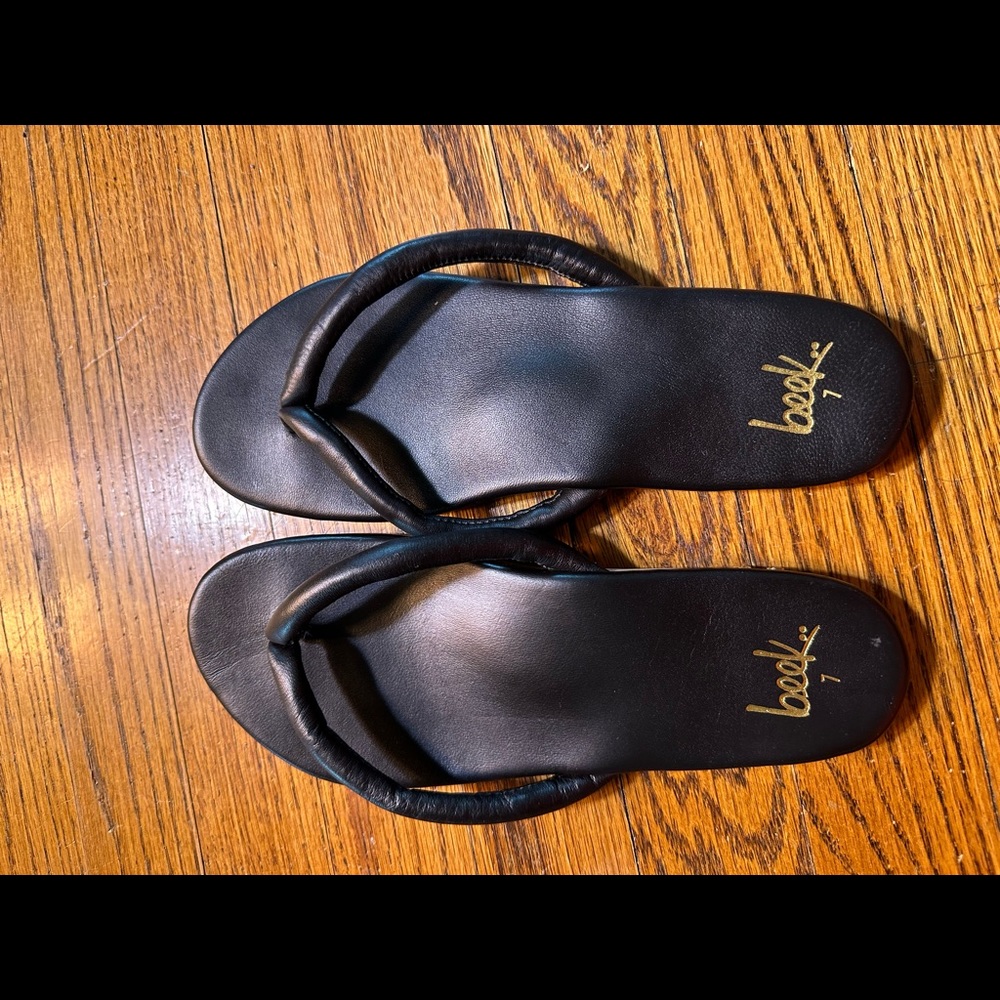 Beek black leather flip flops